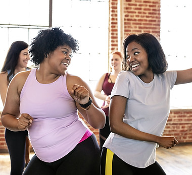 Two girls dancing in a motivational interviewing session.