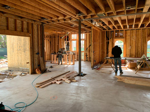 Interior view of a Easton Maryland home residential renovation project during the framing construction phase with exposed wooden studs.