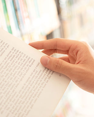 Handing holding a page in a book