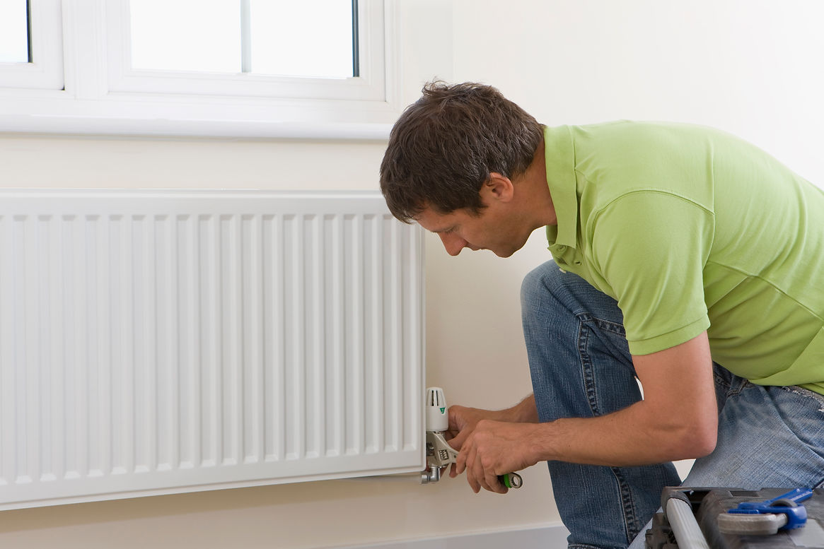 A Person fixing radiator