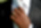 Man adjusting necktie