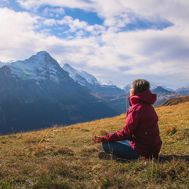Meditating on hillside