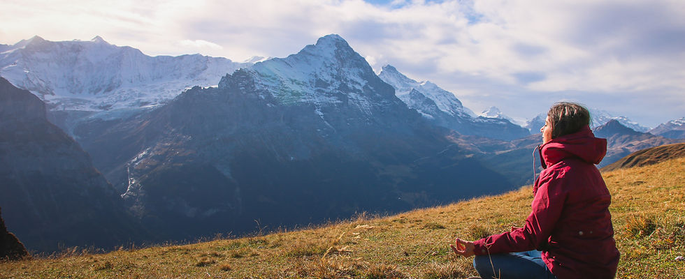 Meditating on hillside