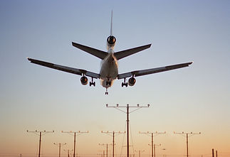 Airplane landing at dusk