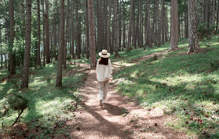 Woman Walking in Forest