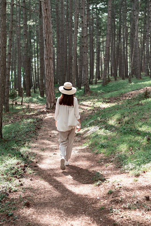 Woman Walking in Forest