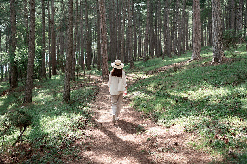 Woman Walking in Forest