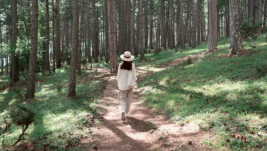 Woman Walking in Forest