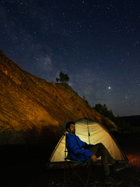 Camper Outside a Tent