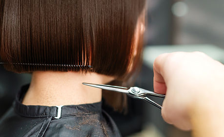 A woman having a hair cut