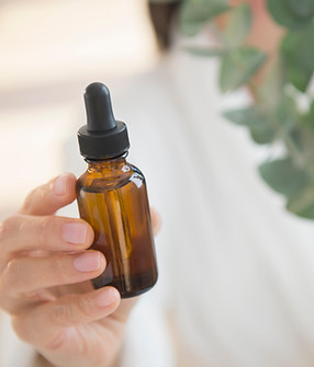 Oil bottle and leaves