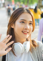 Asian vlogger filming herself on the street
