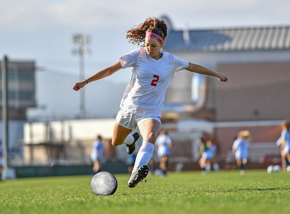 girl playing soccer