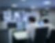 Operators with screens in traffic control room