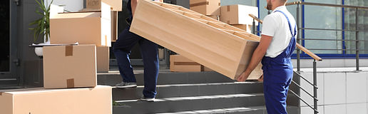 Movers Lifting Furniture