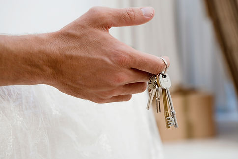 Man holding set of keys, close-up of hand, side view