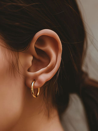 Gold Hoop Earring on Ear