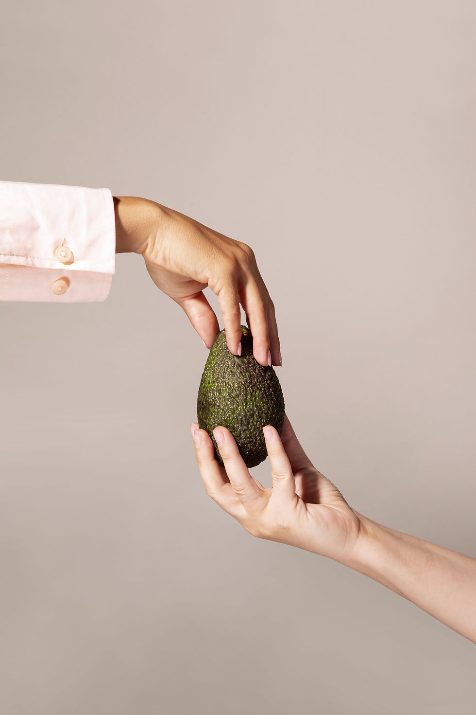 Hands Sharing Avocado