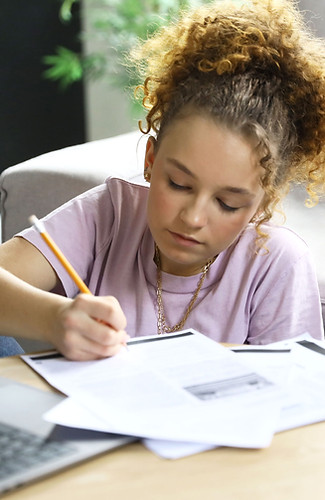 Teenager feeling calm doing homework