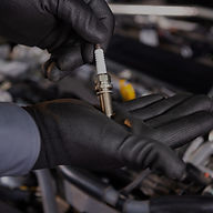 Mechanic Holding Spark Plug