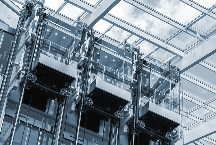 Three modern lift elevators in a contemporary business centre