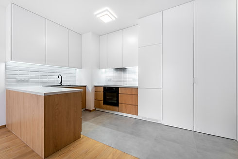 Modern kitchen interior design with white upper walls and wooden finish lower cabinets and island