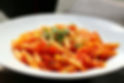 Traditional Italian penne pasta with rich tomato sauce