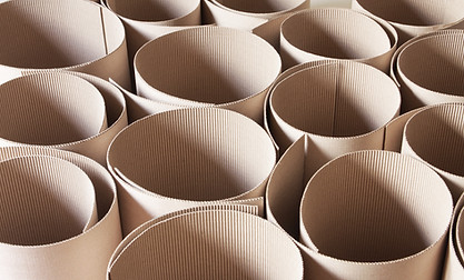 group of corrugated cardboard rolls standing side by side