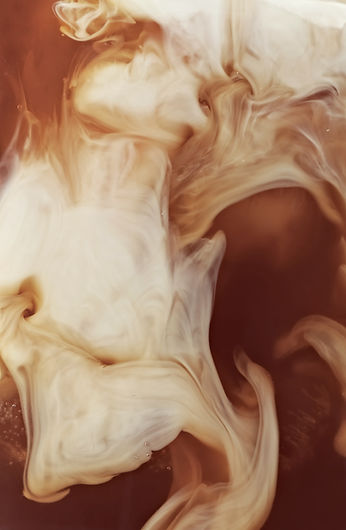 Milk Swirling In Coffee