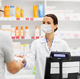 Pharmacist assists customer