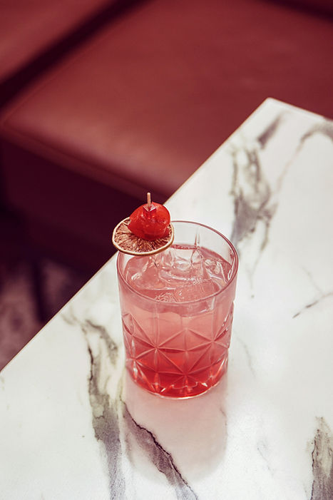 Pink cocktail on table