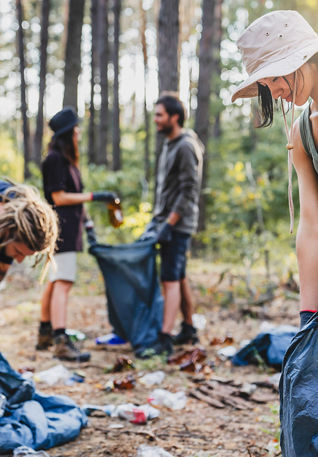 Young people collecting garbage