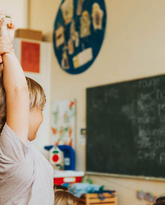 Child raising their hand