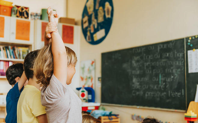 Child raising their hand