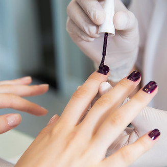 Applying nail polish at a nail salon