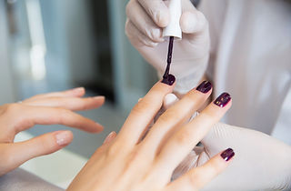 Applying nail polish at a nail salon