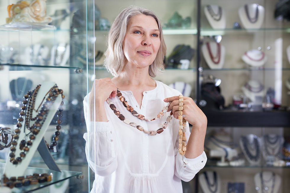 Woman Holding Necklaces