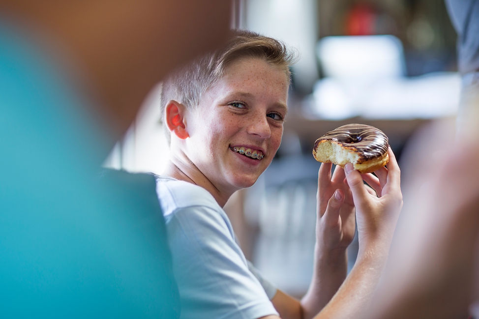 Boy Eating Donut