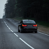 Black sports car on an asphalt road