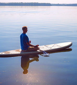 Man Relaxing on Paddleboard