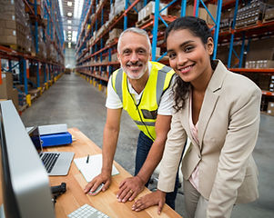 Workers at Warehouse Computer