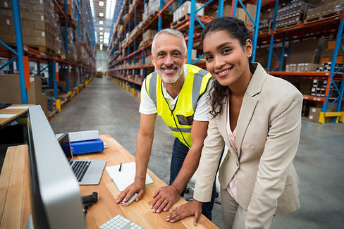 Workers at Warehouse Computer