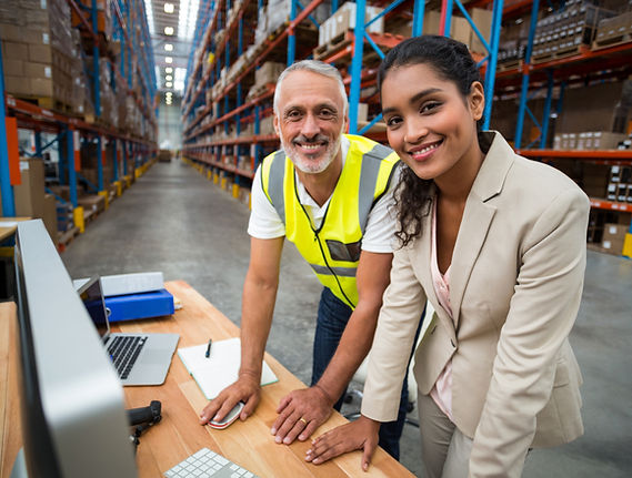 Workers at Warehouse Computer