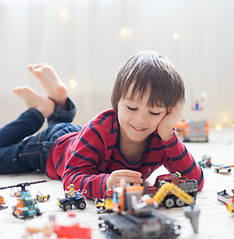 Child Playing With Toys