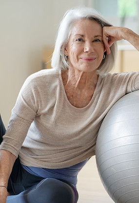 Person leaning on gymnastic ball