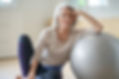 Person leaning on gymnastic ball