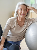Person leaning on gymnastic ball