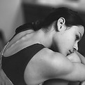 Gymnast Hugging Knees
