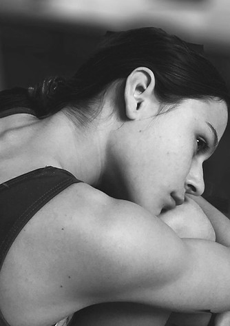 Gymnast Hugging Knees