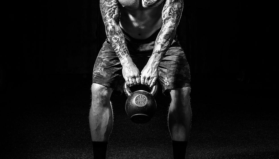 Man Lifting Kettlebell